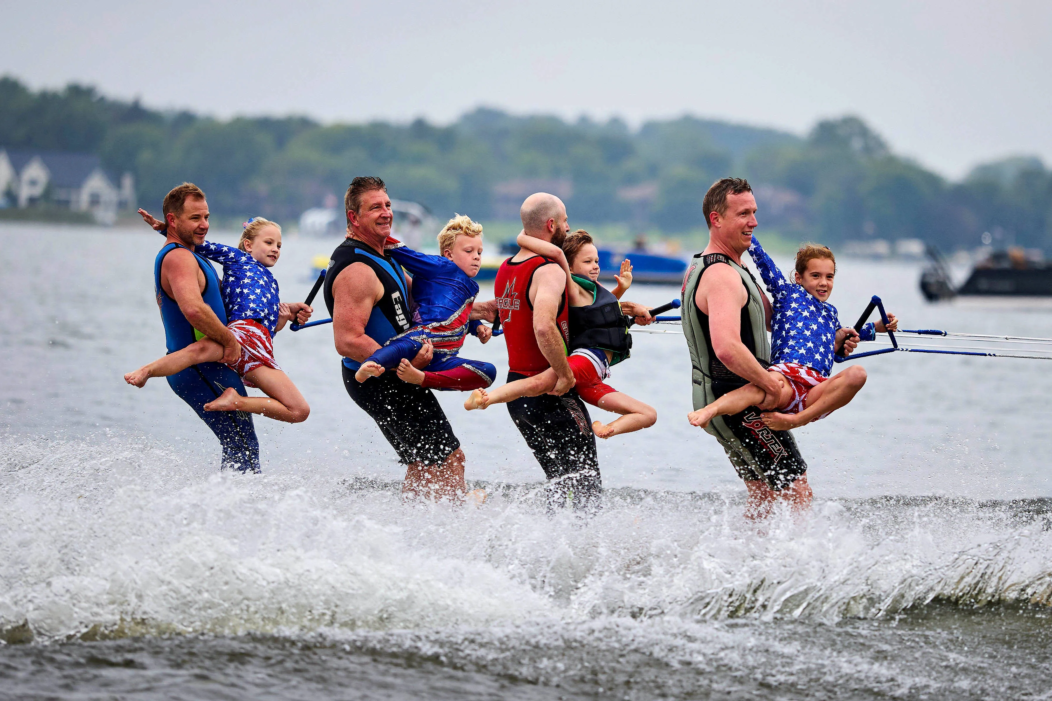 Youth skiers learning to waterski in formation on Lake Minnewashta